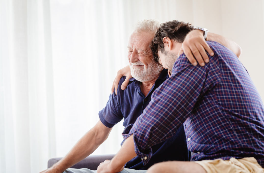 Father and son hugging each other